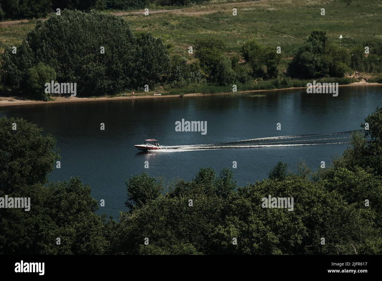 A motorboat goes down the Volga in Tver Stock Photo