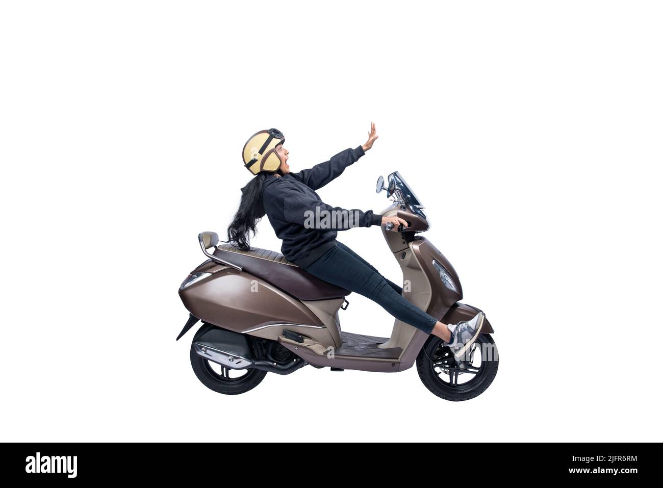 Asian woman with a helmet and jacket sitting on a scooter isolated over white background Stock Photo