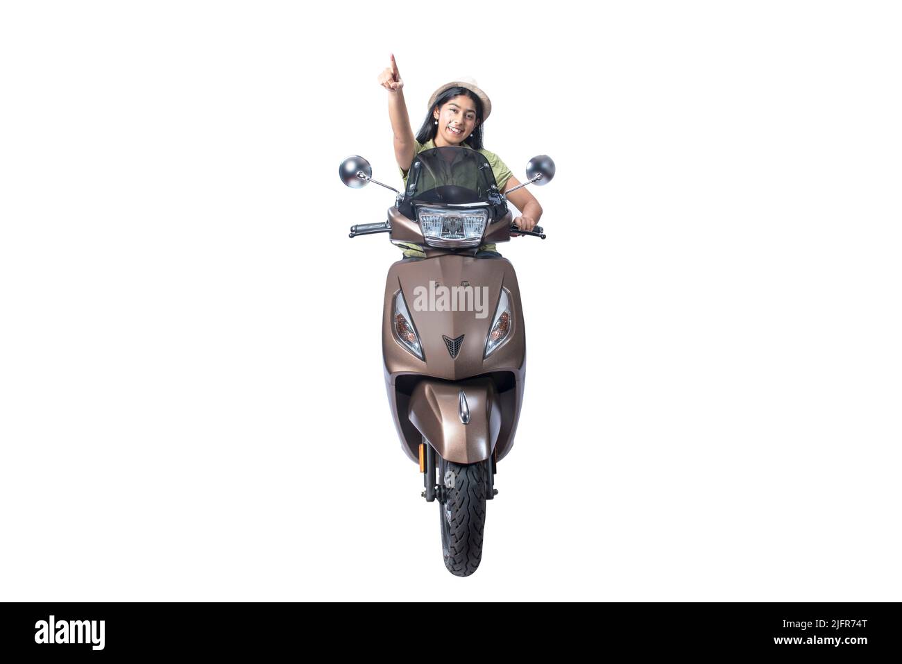 Asian woman with a hat sitting on a scooter and pointing something isolated over white background Stock Photo
