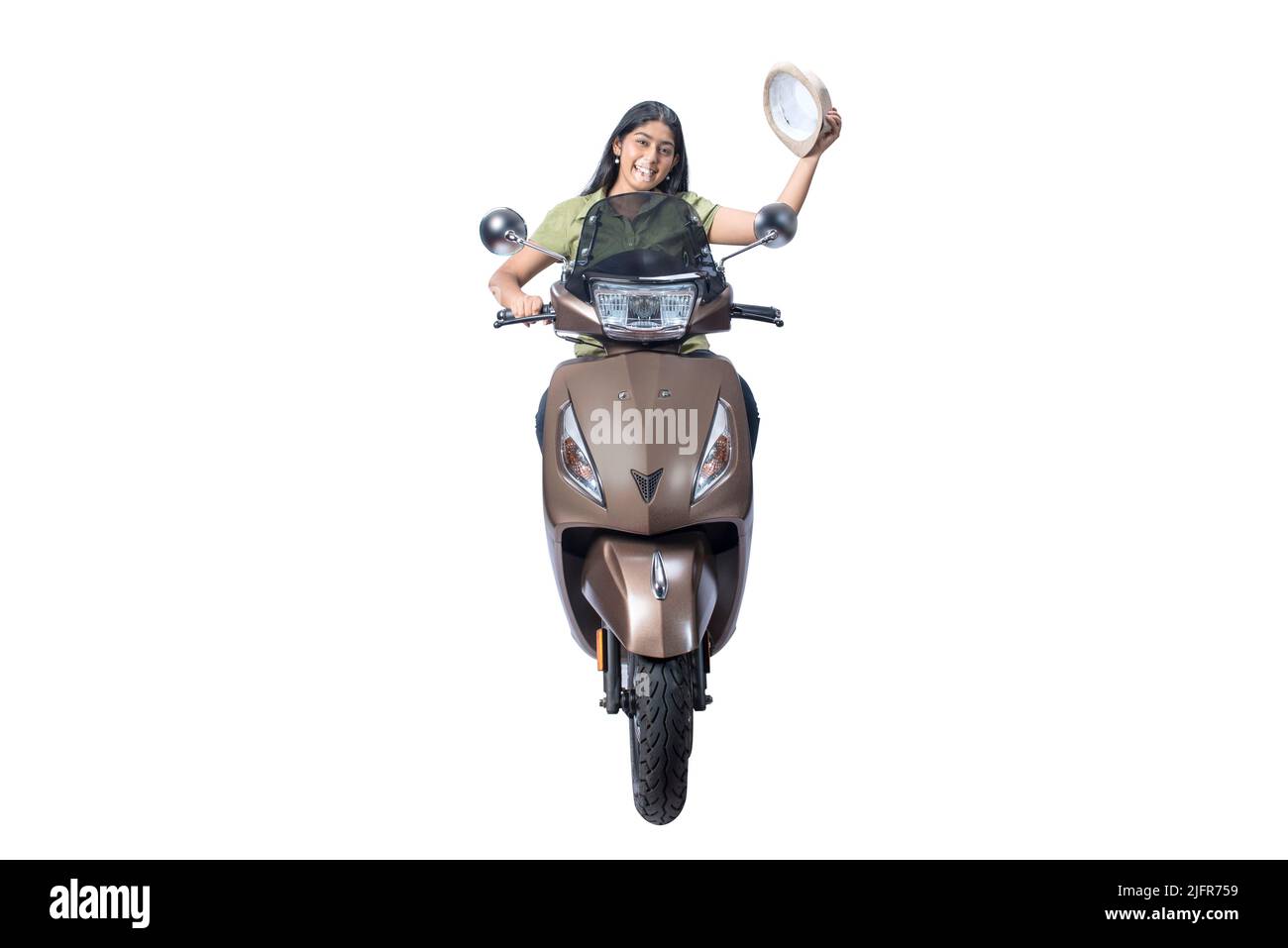 Asian woman sitting on a scooter and taking off hat isolated over white background Stock Photo