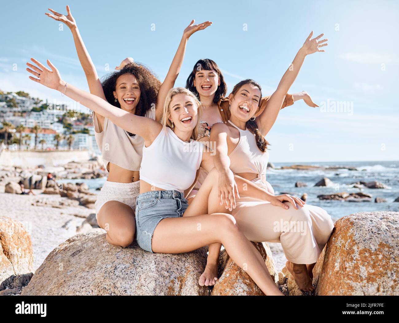 Life is beautiful but friendship makes it makes it extra special. Shot of a group of female friends spending time together at the beach. Stock Photo