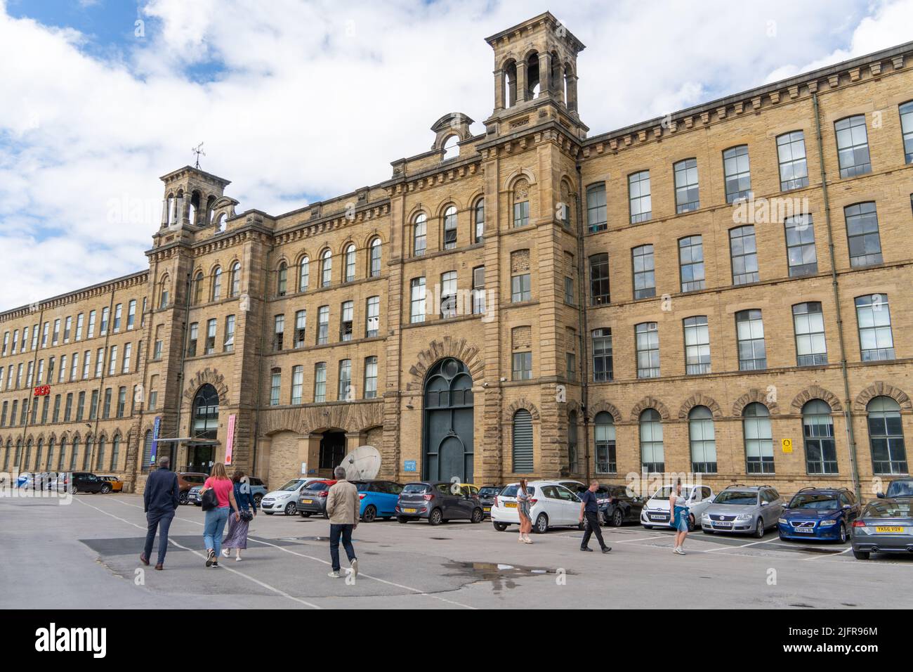 Exterior view of Salts Mill, at the entrance - a former textile mill, now gallery space, shopping and café in Saltaire, Bradford, UK. Stock Photo