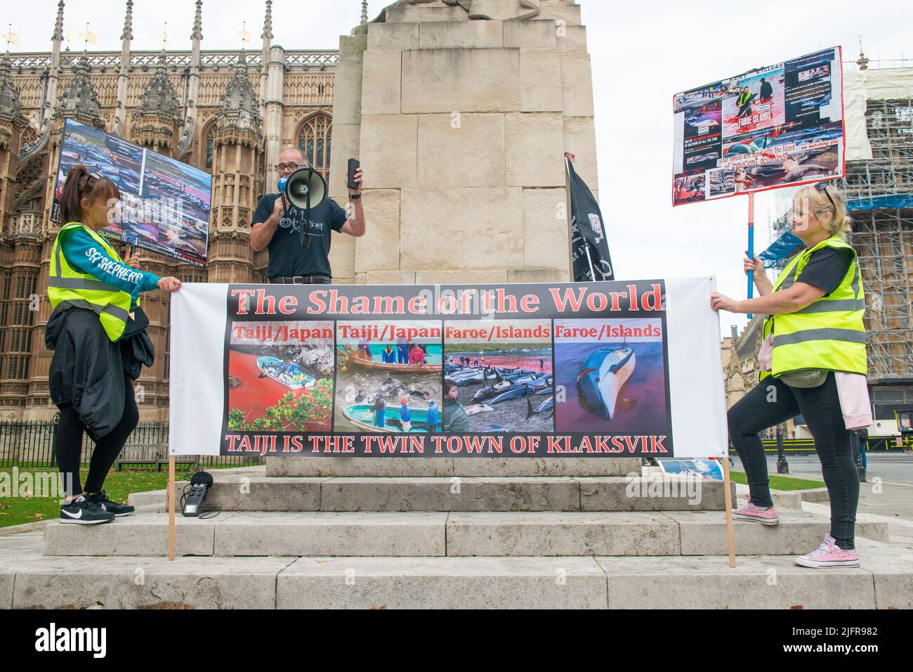 Protest outside Westminster, London, where protesters are campaigning to put a stop to the slaughter of dolphins and whales in the Faroe Islands, Stock Photo