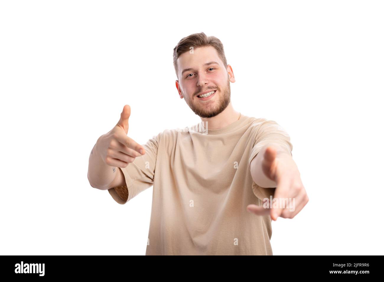 Smiling man pointing index fingers Stock Photo