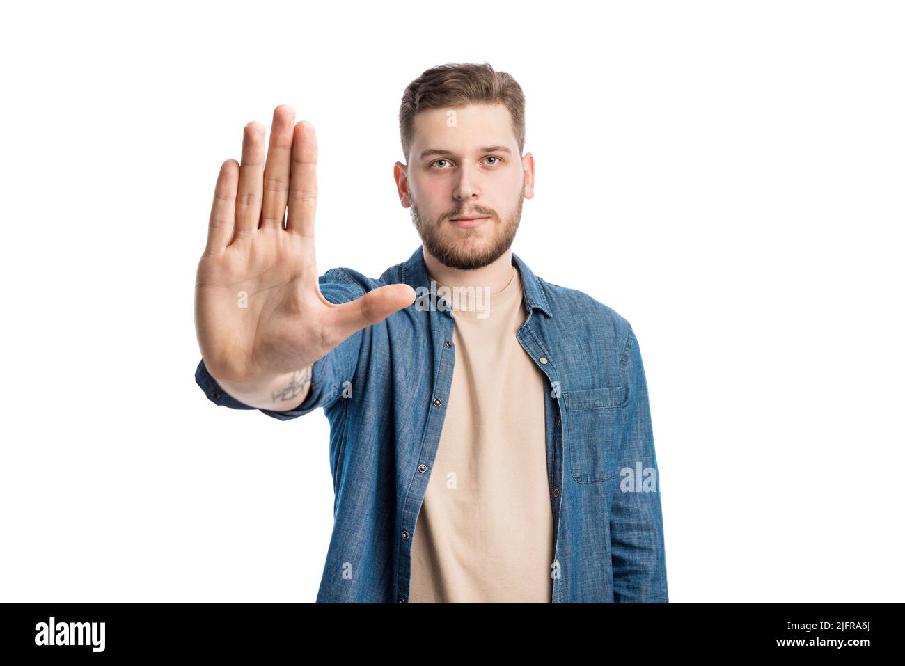 Caucasian male giving stop sign Stock Photo