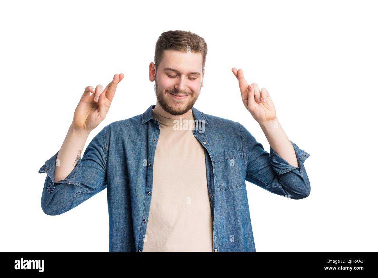 Man crossing fingers for luck Stock Photo