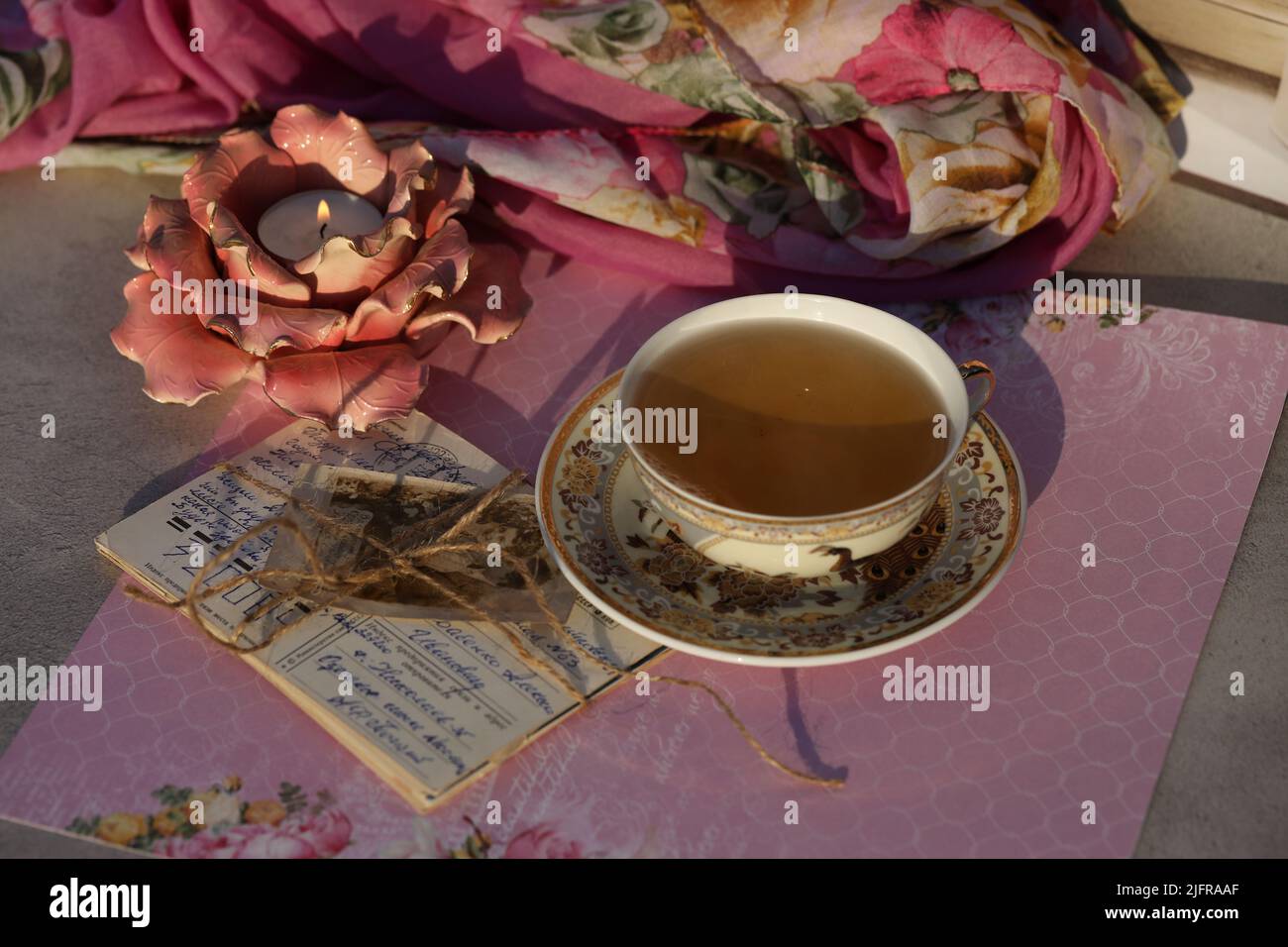 still life with cup of tea, candle and retro cards Stock Photo - Alamy