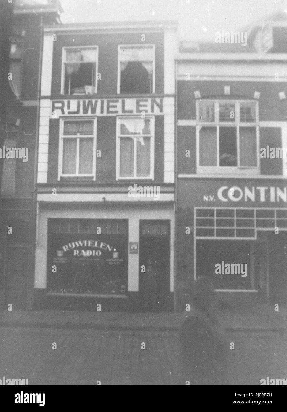 The Bicycle & Radio Shop of De company Doorman Stock Photo Alamy