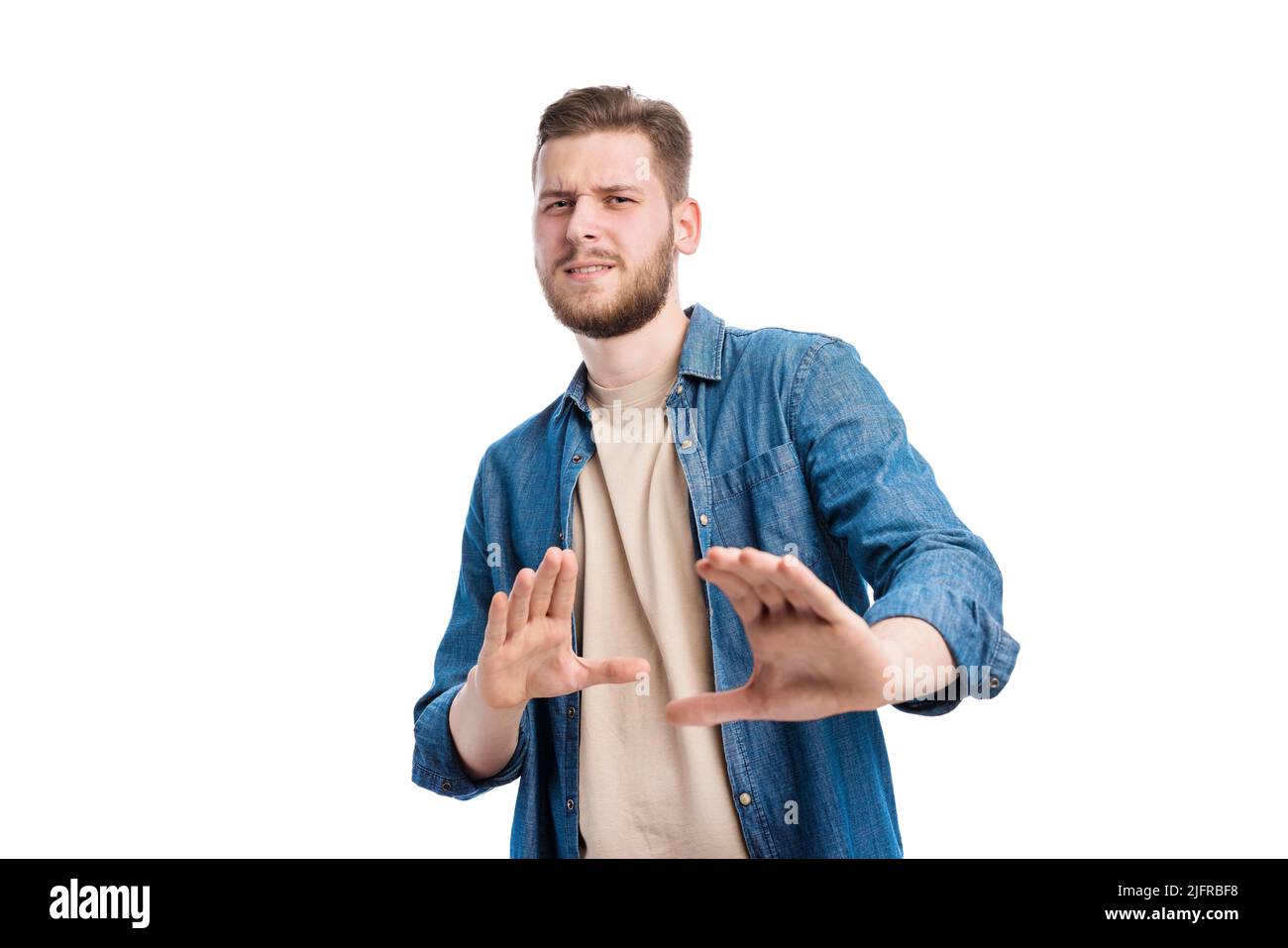 Dissatisfied man showing rejection Stock Photo