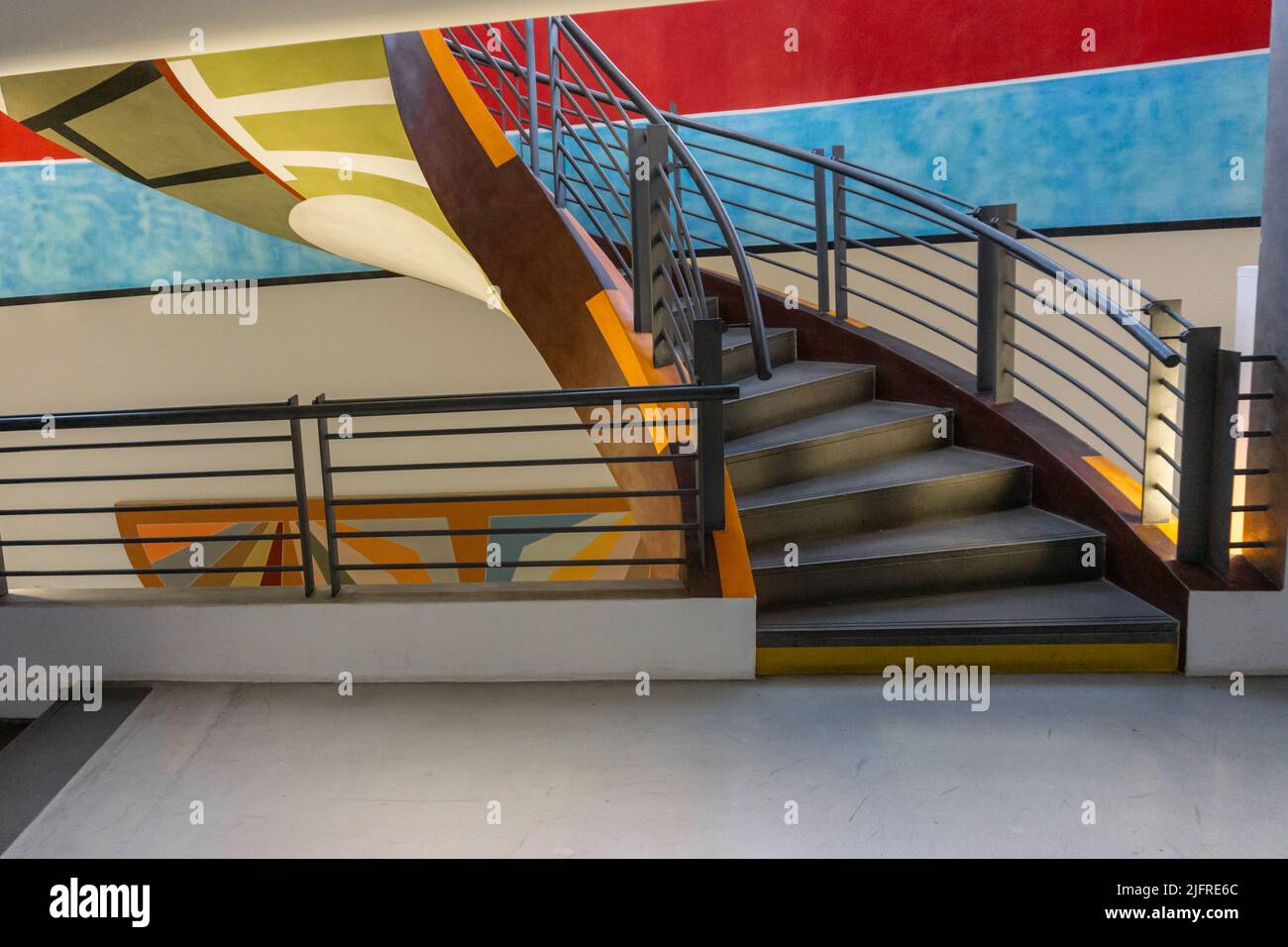 Colorful image with the modern architecture of twisted stairs inside ...