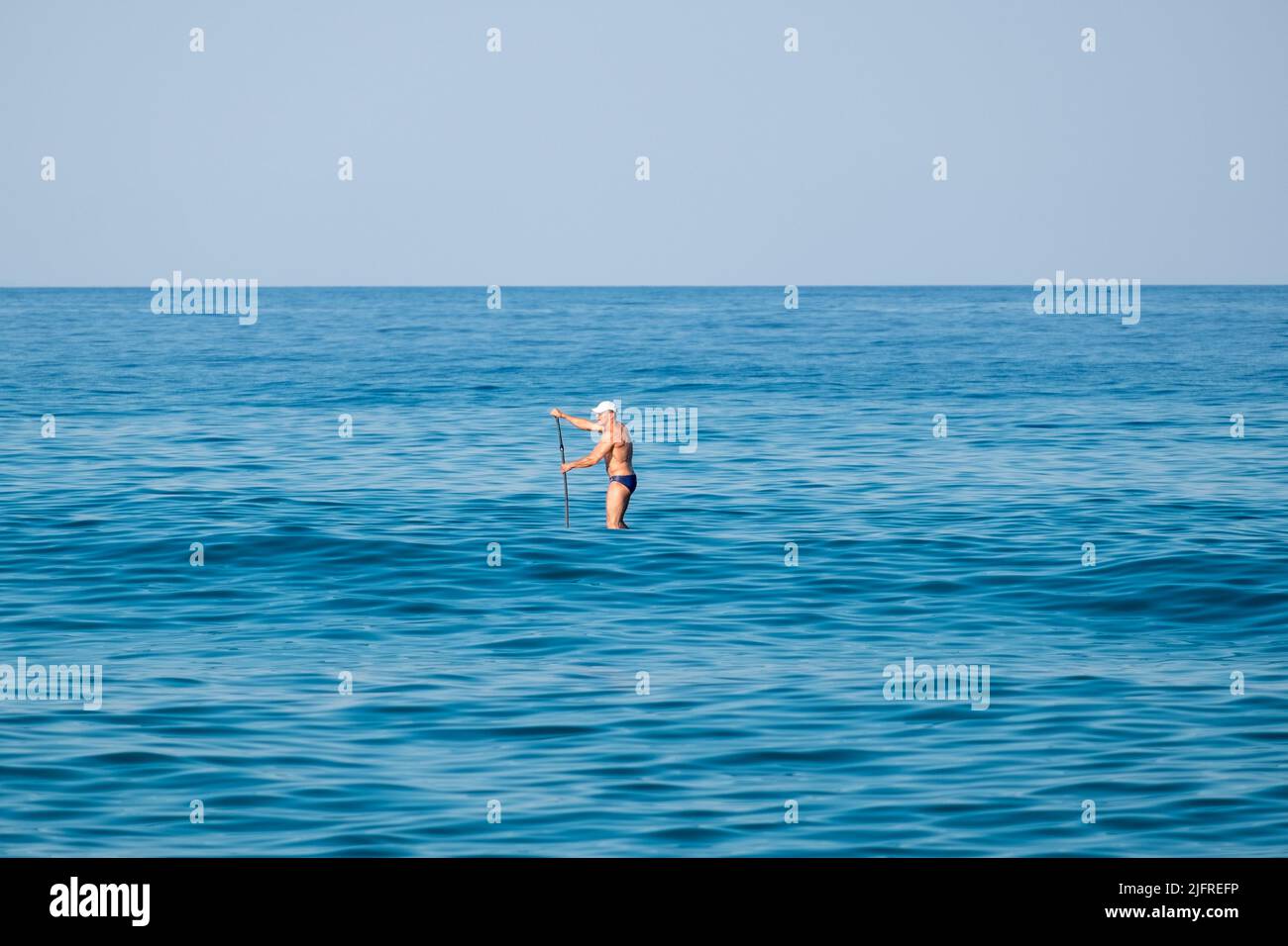 A man on  stand up paddleboard Stock Photo