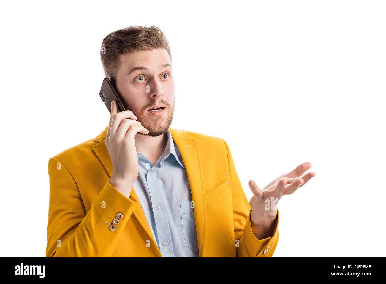 Surprised man having mobile call Stock Photo