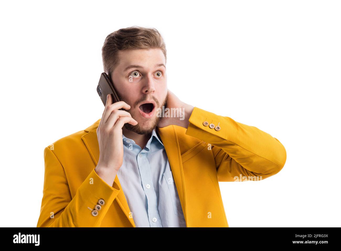Surprised man during phone conversation Stock Photo