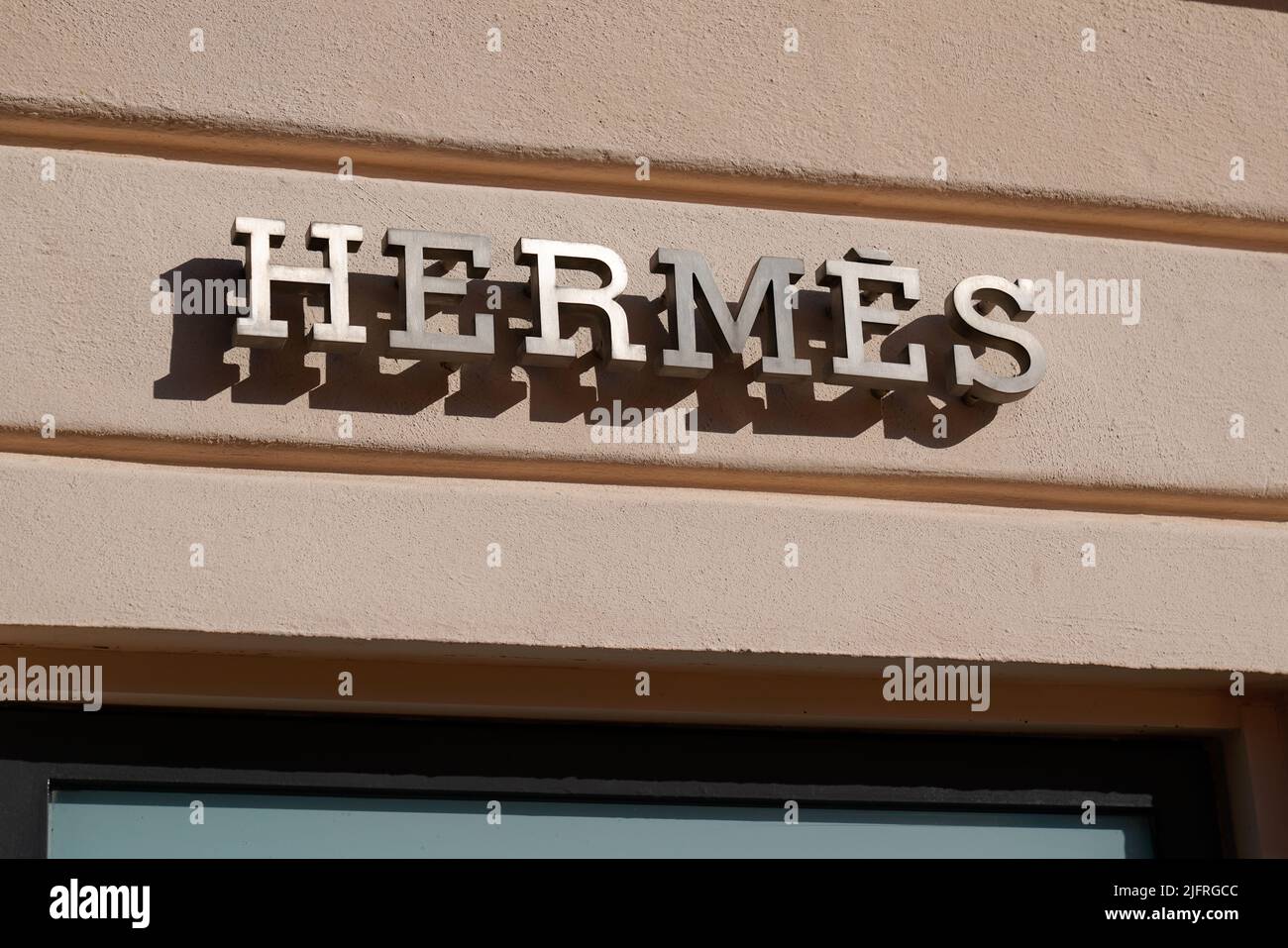 Cannes , paca  France - 06 15 2022 : Hermes logo sign and text brand front wall facade fashion shop luxury goods manufacturer Hermes boutique Stock Photo