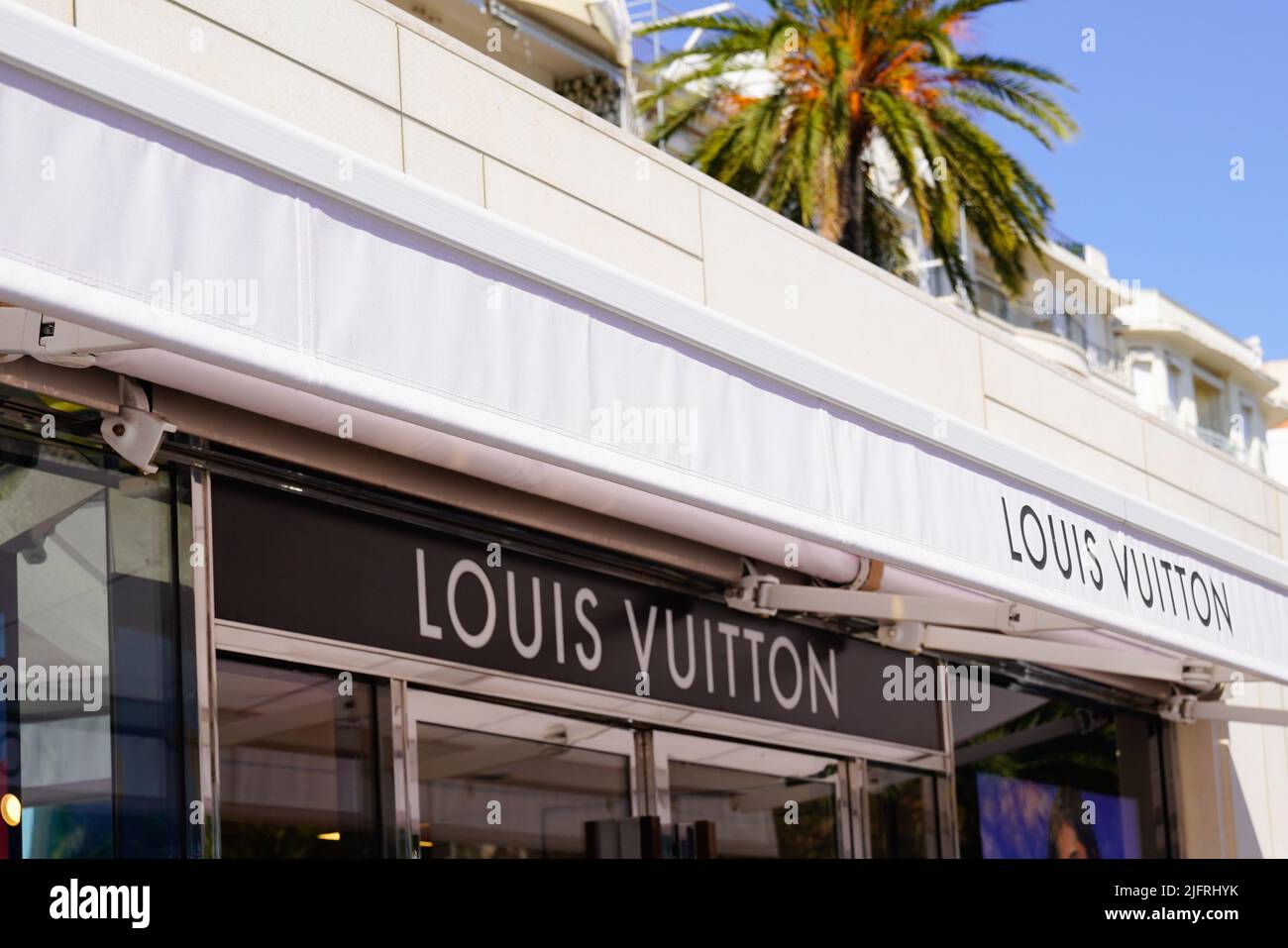 Cannes , paca  France - 06 15 2022 : Louis Vuitton logo sign and brand text shop entrance facade French luxury fashion house store Stock Photo