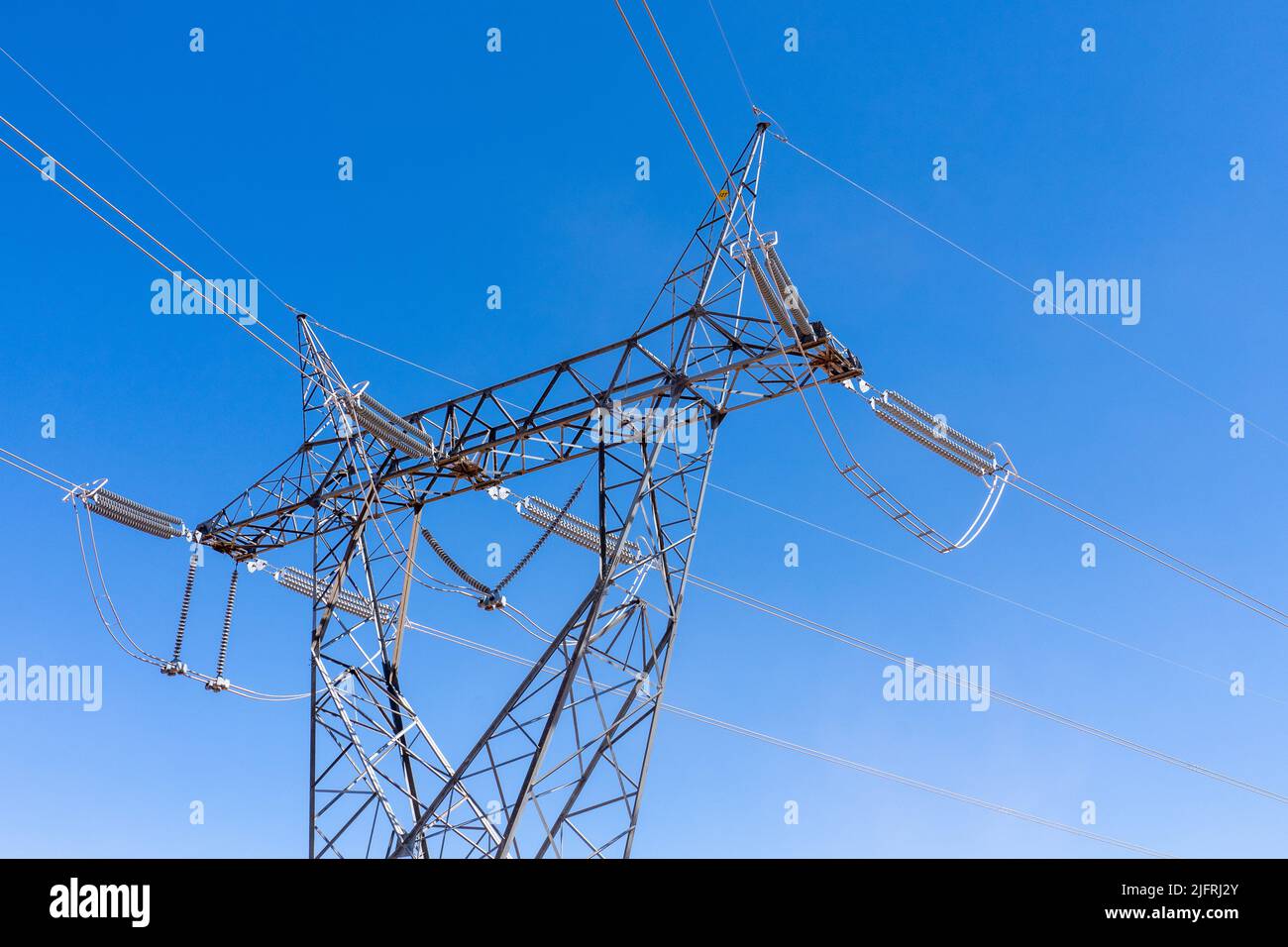 A steel girder tower for high-voltage electricity transmission lines. Stock Photo