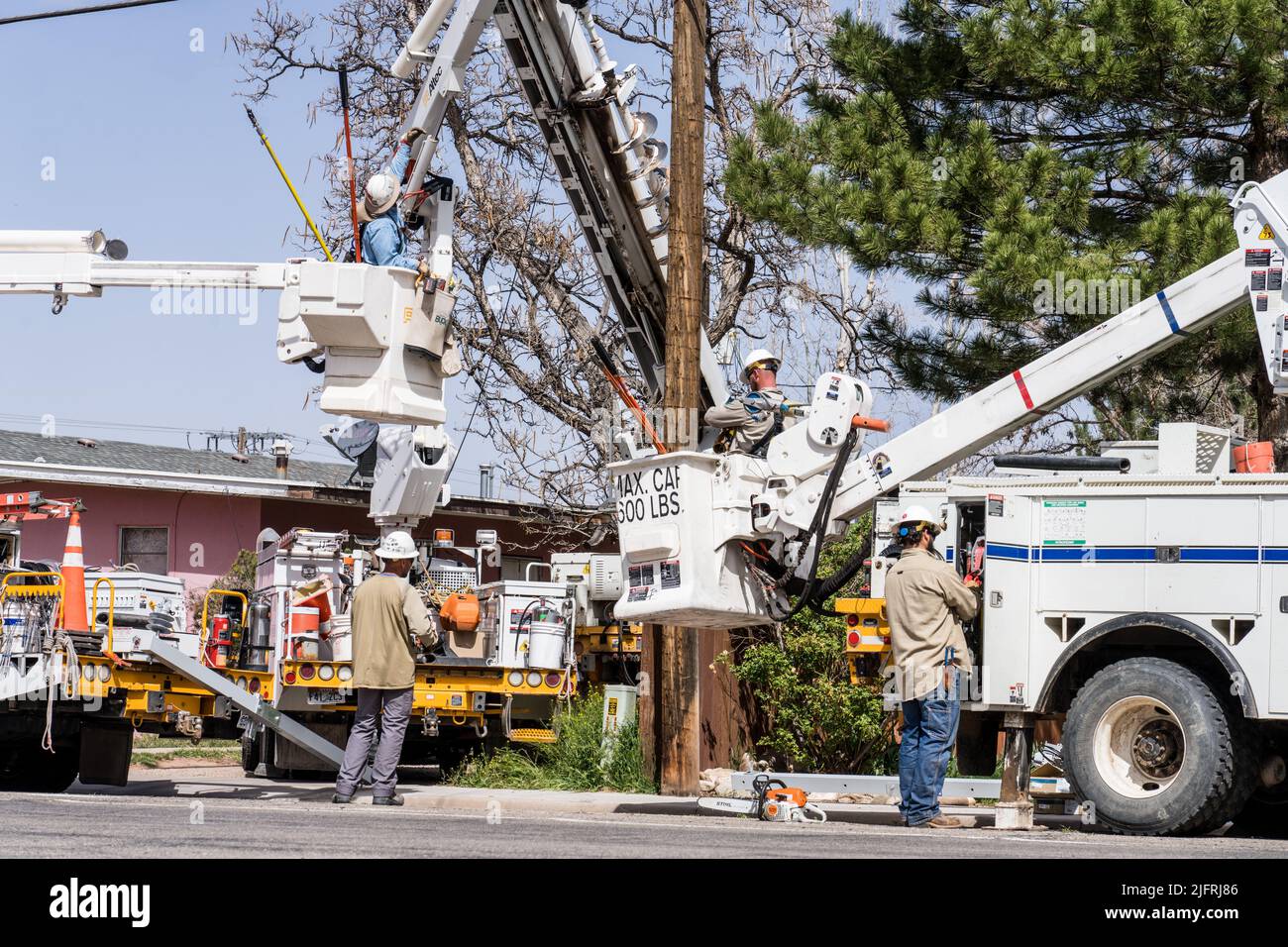 Electrical workers make perform maintenance on live electrical