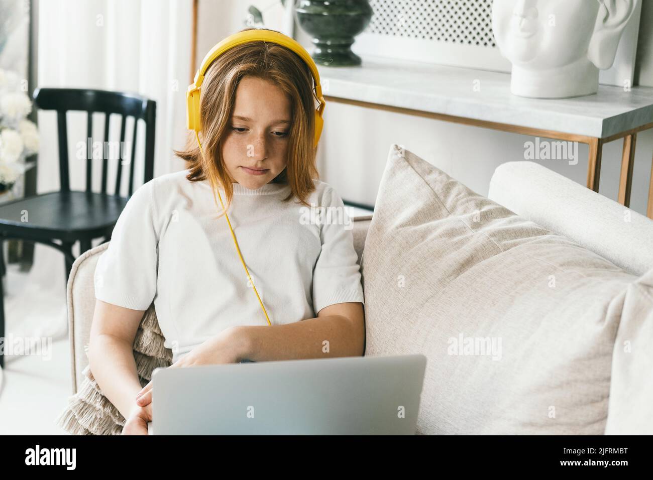 A teenager is resting at home on the couch Stock Photo - Alamy