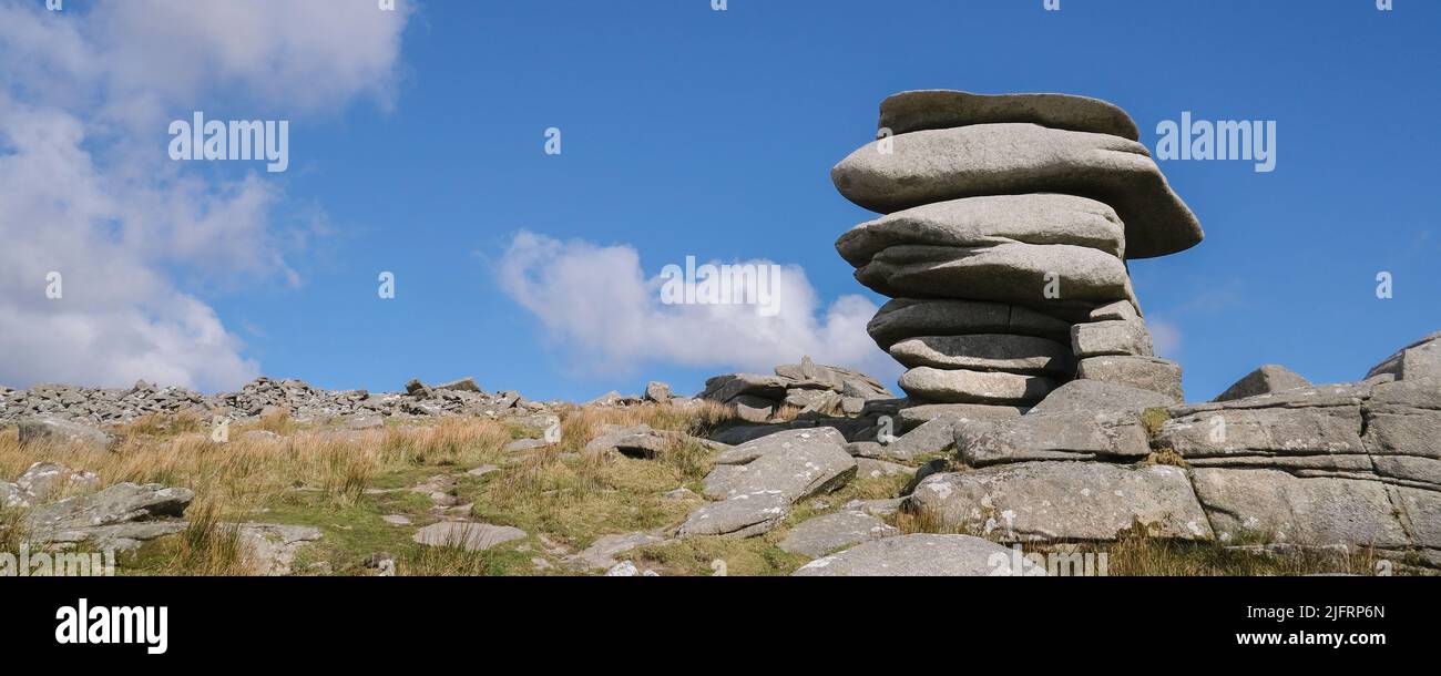 A panoramic image of the towering granite rock stack The Cheesewring left by glacial action on Stowes Hill on Bodmin Moor in Cornwall. Stock Photo