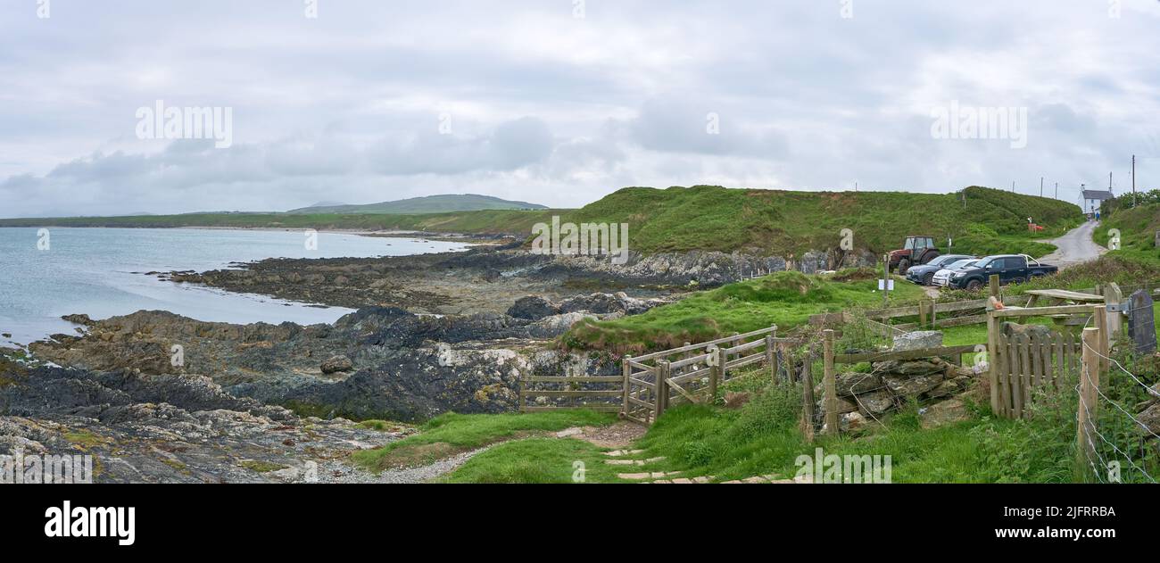 Looking eastwards from the Wales Coast Path at the car park and slipway at Porth Colmon on the Llyn Peninsula Stock Photo