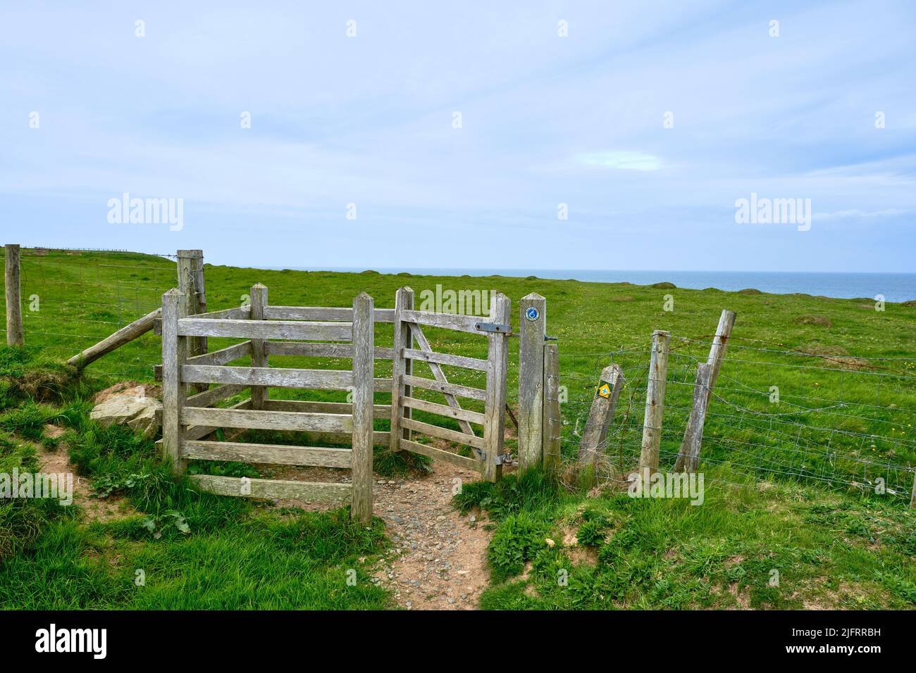 A kissing gate on the Wales Coast Path near Porth Colmon on the Llyn Peninsula Stock Photo
