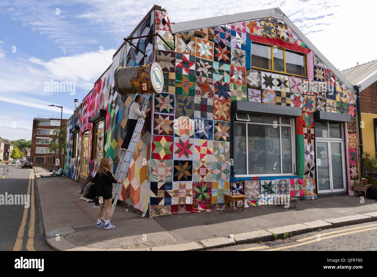 Giant quilt covered warehouse, Overbury Road, Haringey, London, UK Since November 2021 'Quilt Club' have created a quilt big enough to cover a buildin Stock Photo