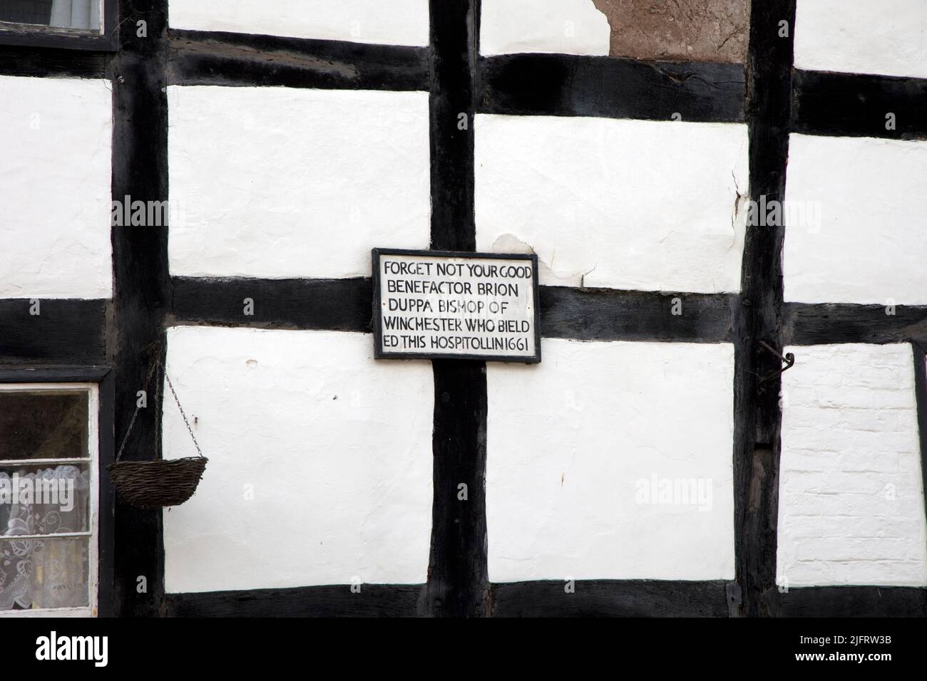Memorial plaque to Bishop Duppa who endowed this former hospital in 1661 Pembridge Arrow Valley mediaeval village Herefordhire UK Stock Photo