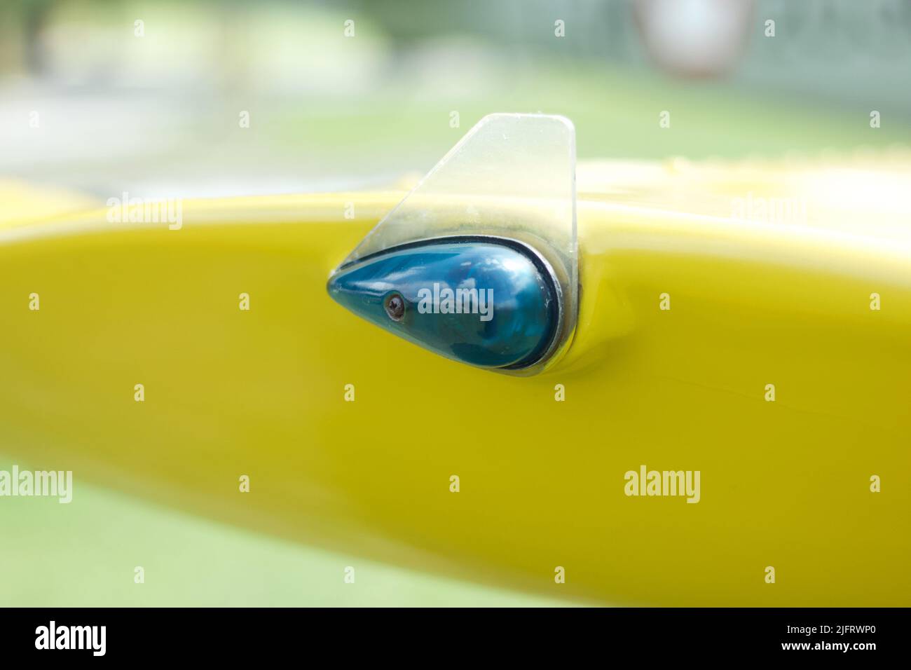 Blue aviation navigation lights on yellow wing of an old aircraft Stock