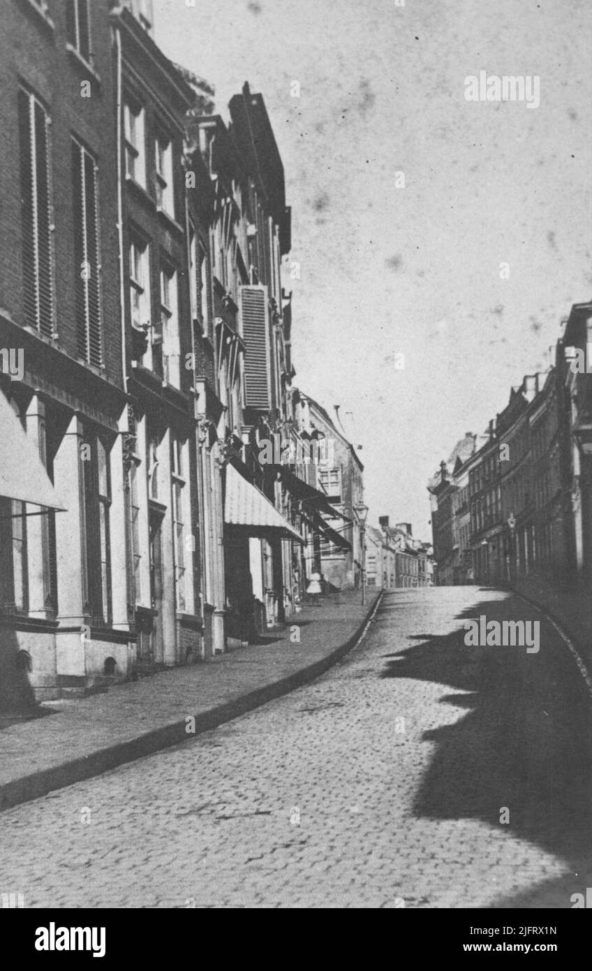 The Korte Hezelstraat towards Grote Markt as the street was then called on a summer day. The name Boven-Hezelstraat was also used, but on 2 February 1921 the official name was Stikke Hezelstraat. At the bombing of February 22, 1944, the street was almost completely wiped out Stock Photo