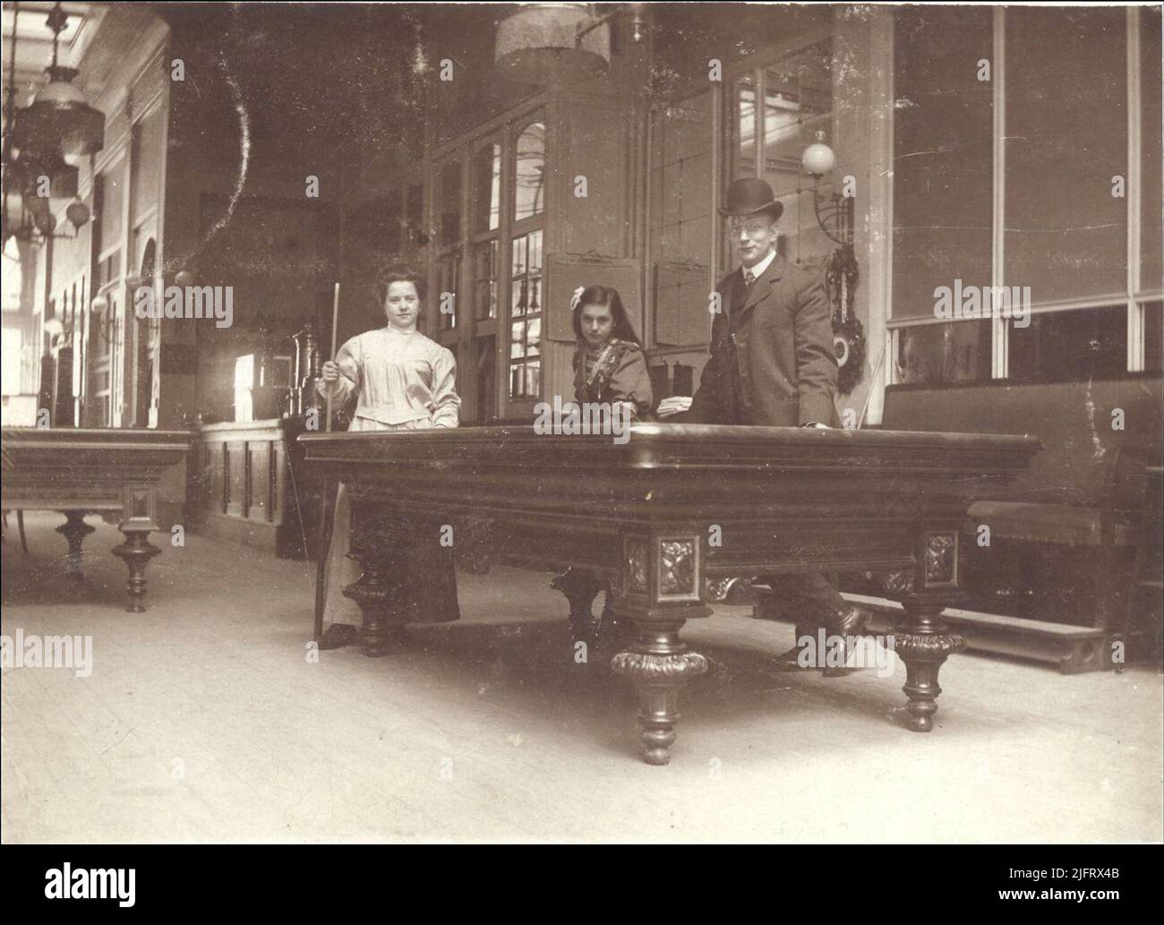 The billiard room in café Restaurant Suisse, on the south side of Lange Burchtstraat, opened in 1880 with the owner Gradus Antonius Roelofs (1854-1912); In 1891 J.S.W. Cleerdin the manager and in 1905 A. Joosen. Stock Photo