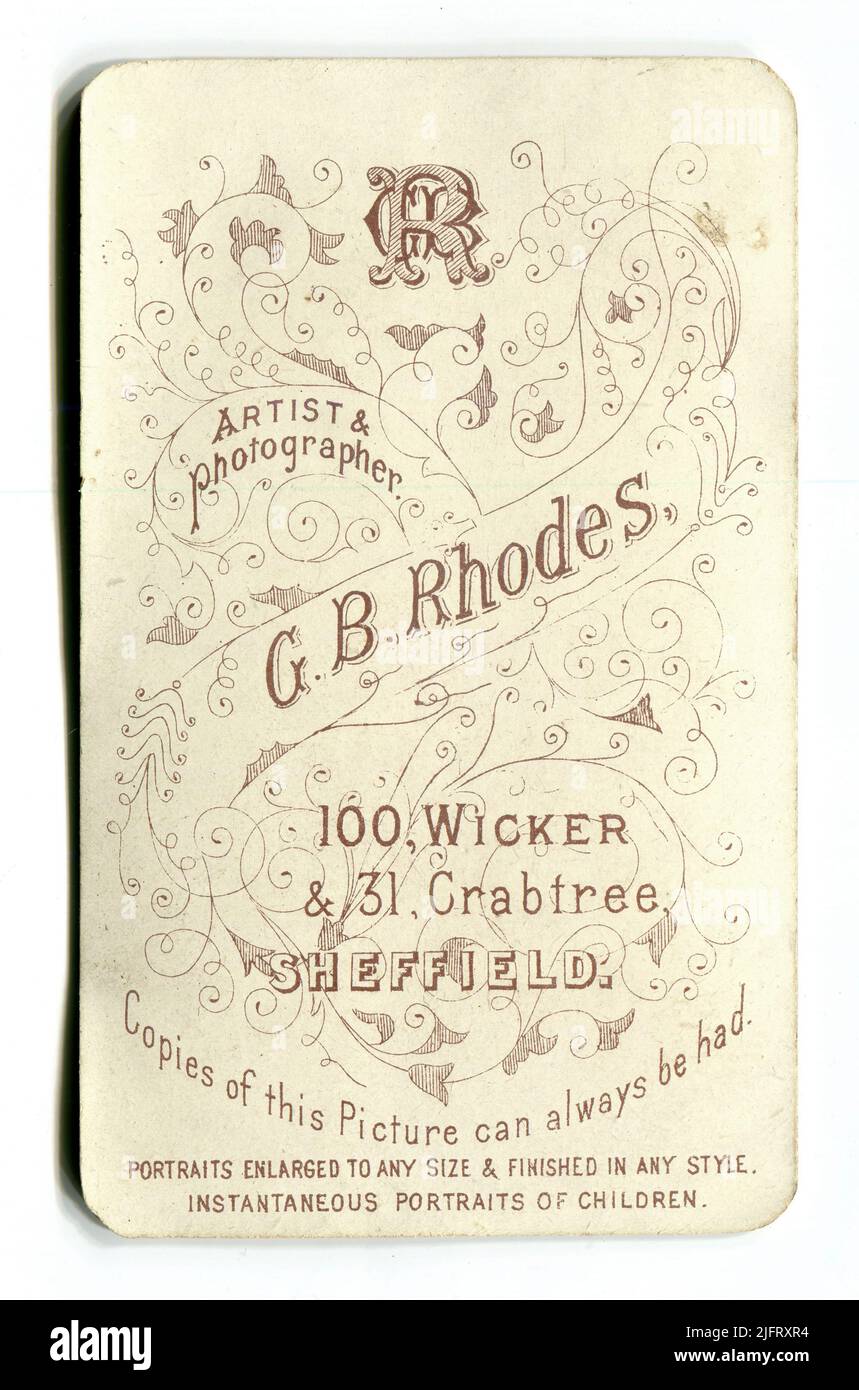 The reverse of a Victorian English carte de visite photograph advertising the services of “G. B. Rhodes, Artist & Photographer” (George Booth Rhodes) of “100 Wicker & 31 Crabtree, Sheffield”. It also states that “Copies of this picture can always be had – Portraits enlarged to any size & finished in any style – instantaneous portraits of children”. Circa. 1890s Stock Photo