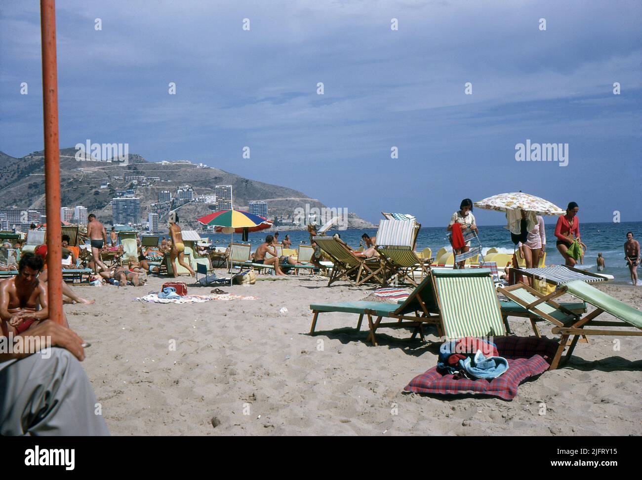 Costa Blanca, Spain. 1970. Holidaymakers enjoying the beach at Benidorm. Stock Photo