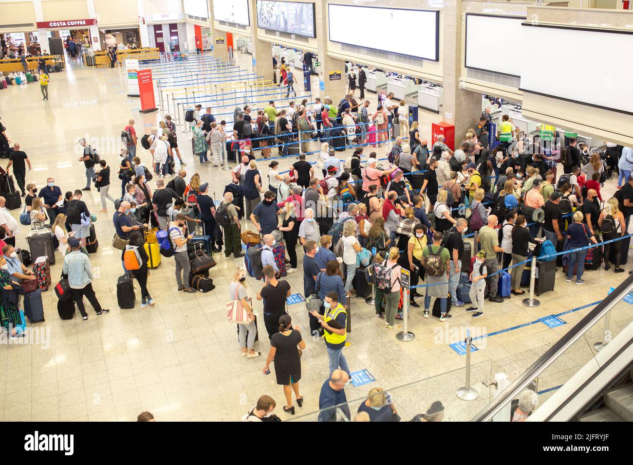 Luqa, Malta - October 22, 2021: People lining up to check-in counters at the Luqa airport in Malta. Stock Photo