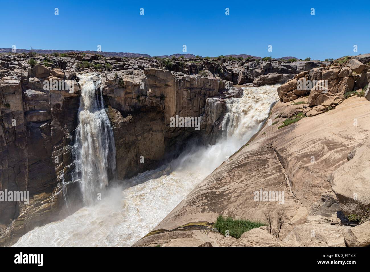 Augrabies Water fall in the Orange river during flood season.  The waterfall is in the semi arid area of the Northern Cape Province of South Africa Stock Photo