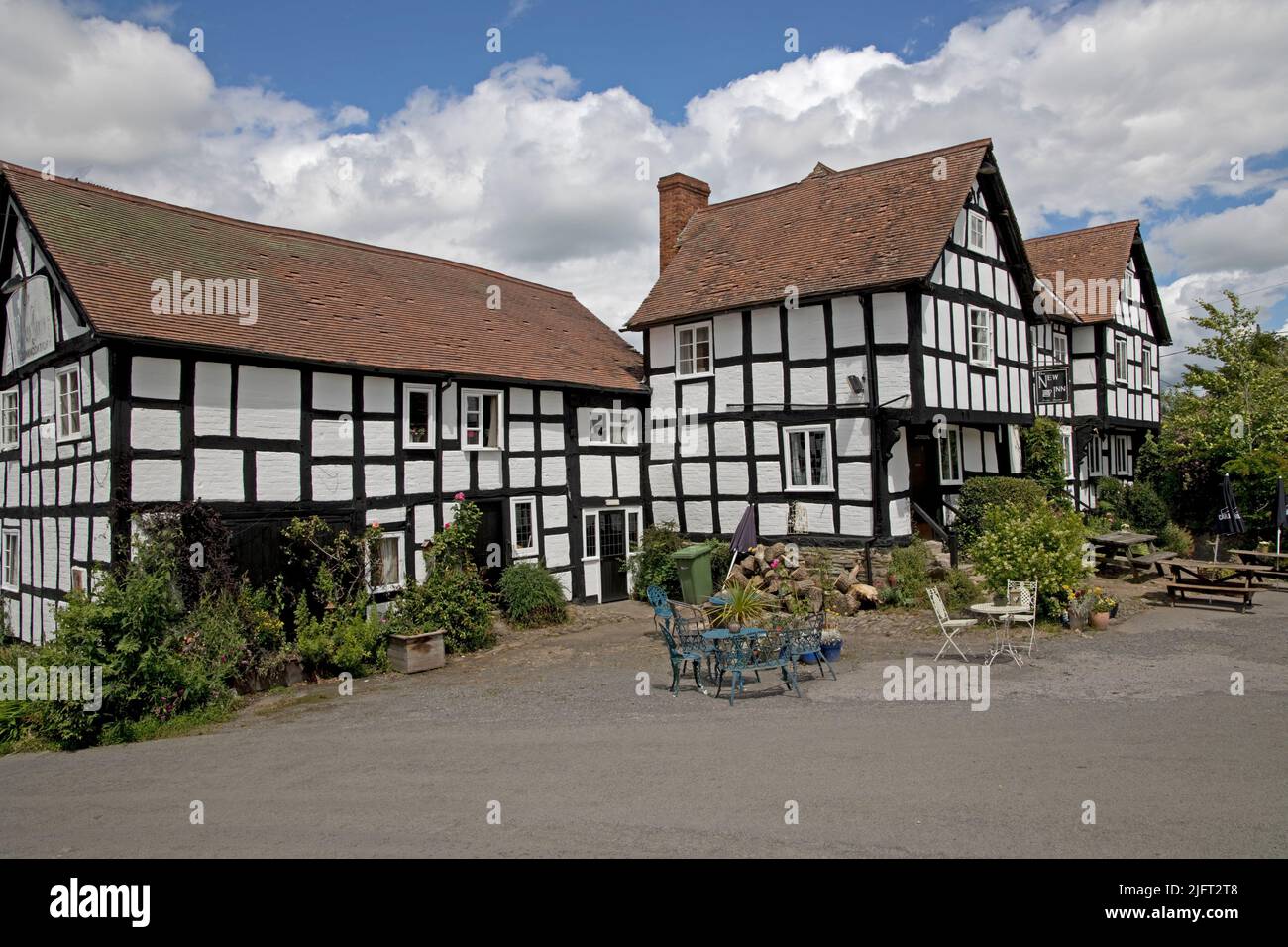 The New Inn is a listed medieaval half-timbered old coaching inn which is now a Public House in Pembridge Herefordshire UK Stock Photo