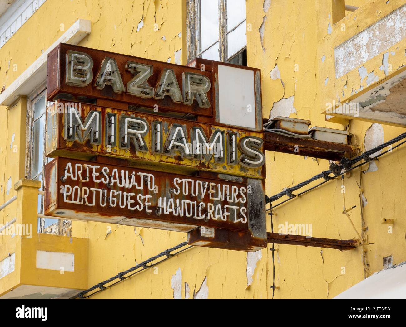 An Old Retro Neon Shop Sign In Portimao, Portugal Bazar Miriamis Tourist Souvenirs Stock Photo