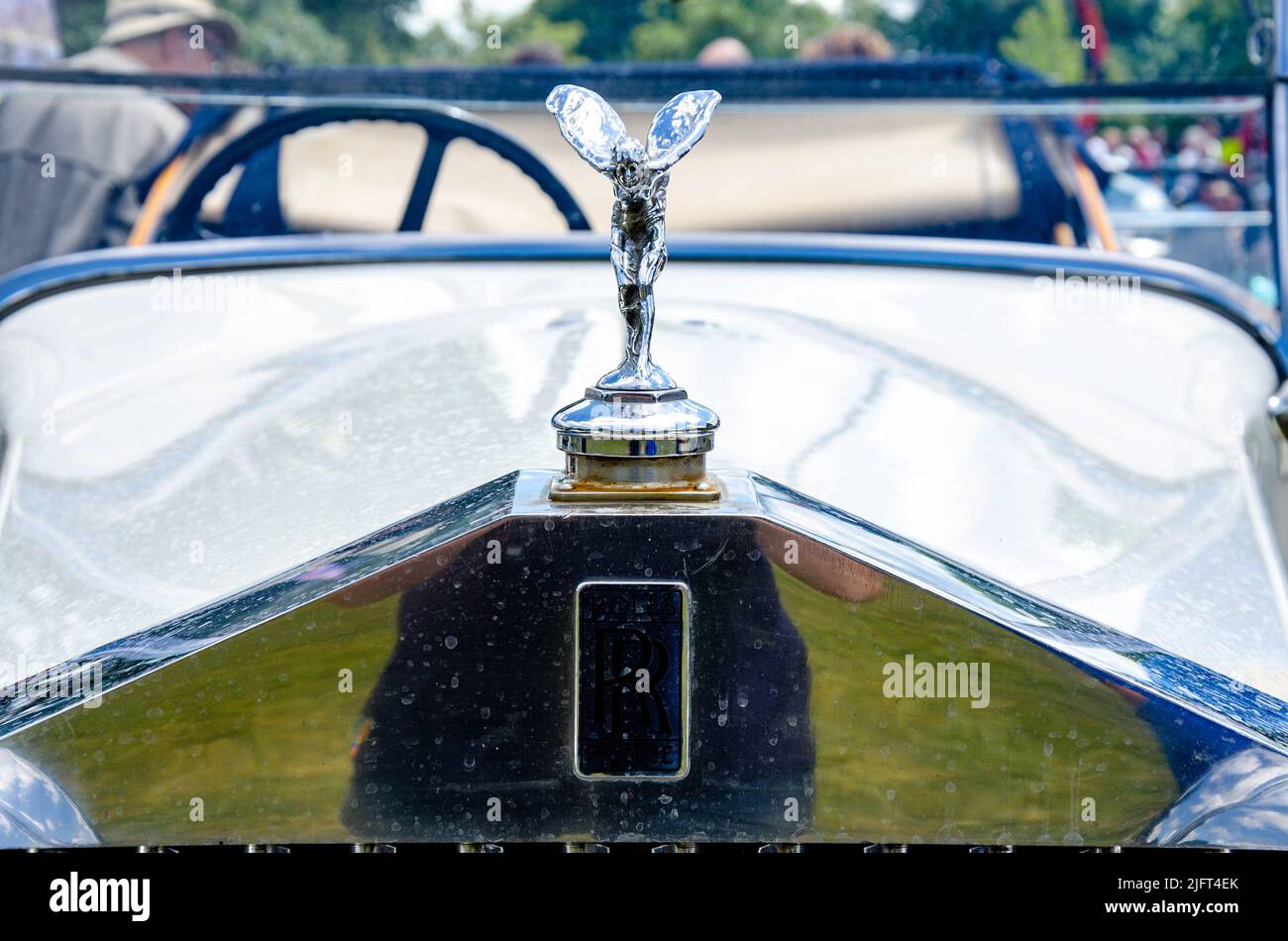 The 'Spirit of Ecstasy' figurehead on the front of a white 20/25 Rolls Royce at The Berkshire Motor Show in Reading, UK Stock Photo
