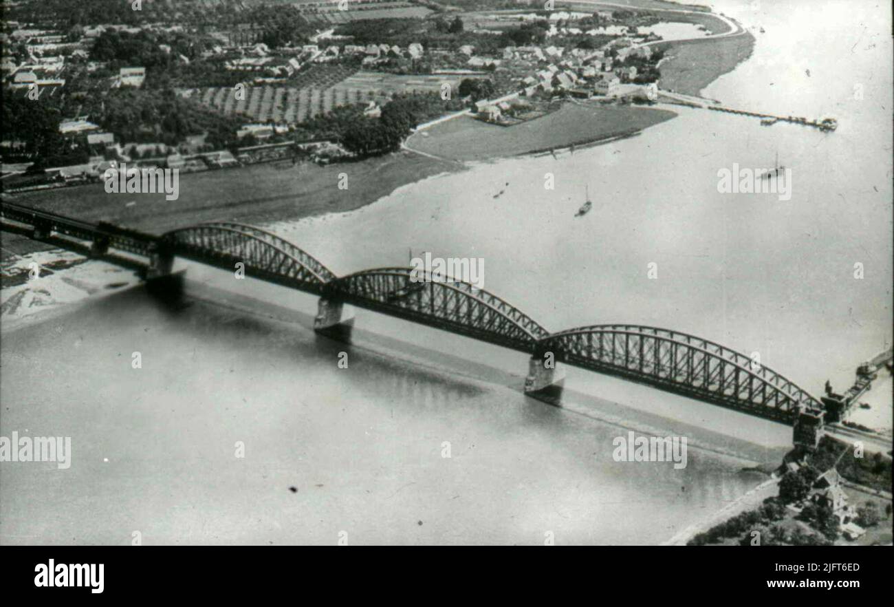 KLM photo of the railway bridge towards Lent with the jetty for the ferry. Stock Photo