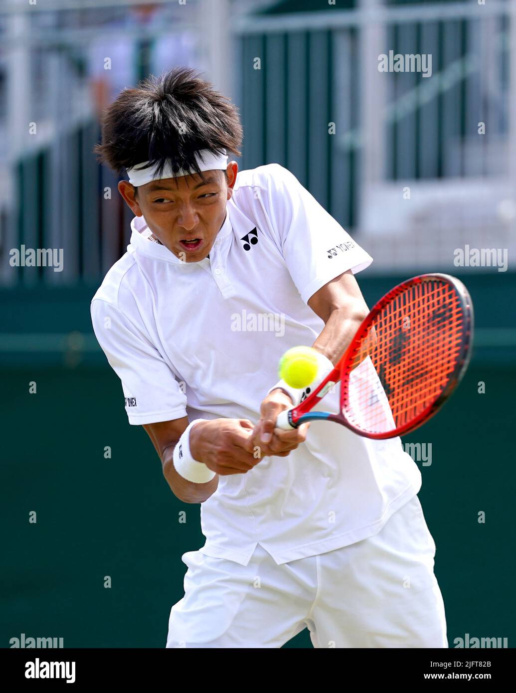 Aidan Kim in action during his Boys Singles second round match against Gabriel Debru on court 12 on day nine of the 2022 Wimbledon Championships at the All England Lawn Tennis and