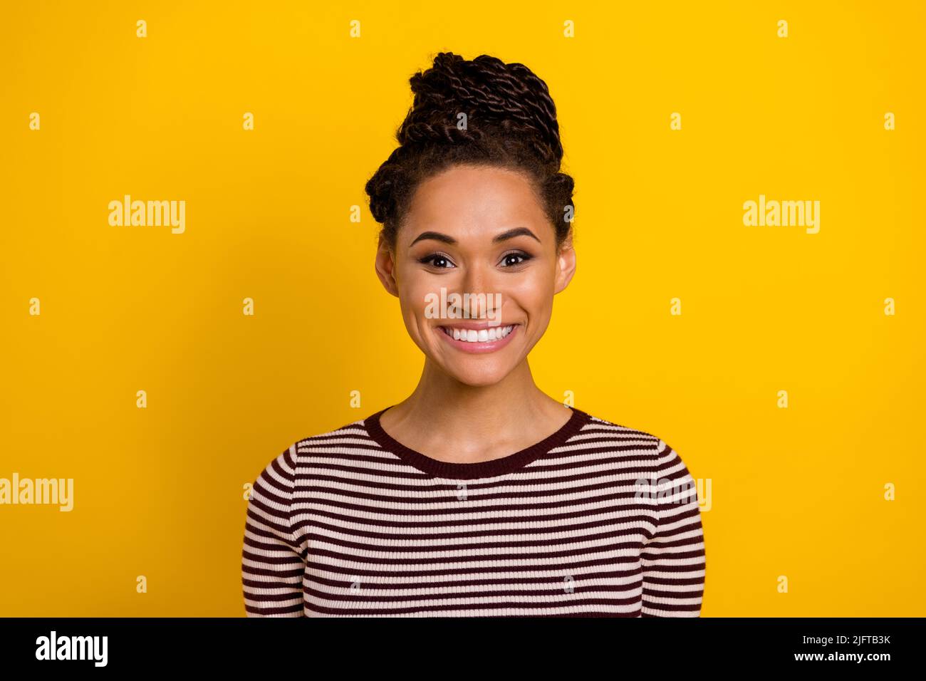 Photo of positive pretty girl toothy beaming smile have good mood isolated on yellow color background Stock Photo