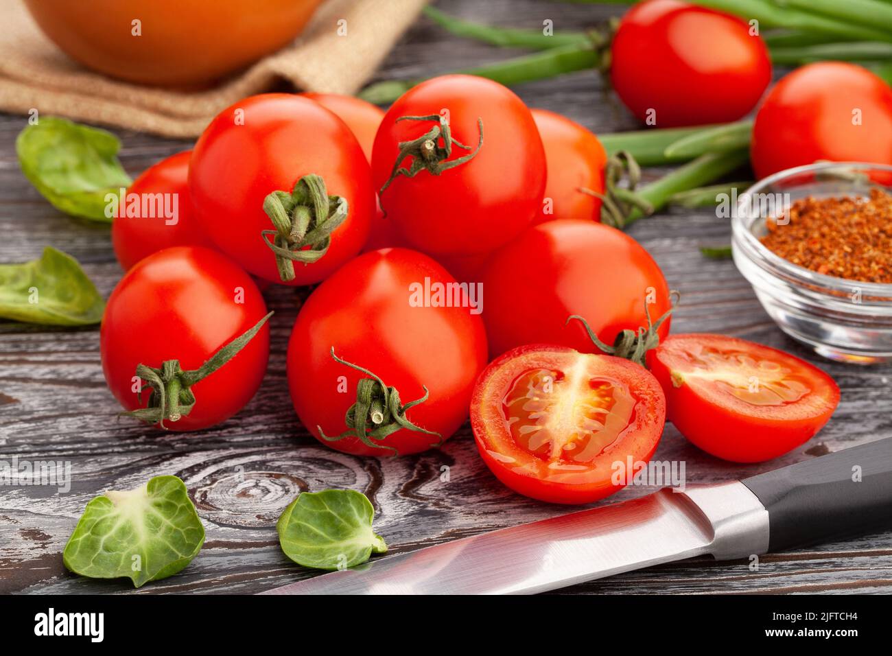 sliced cherry tomato on wood background Stock Photo