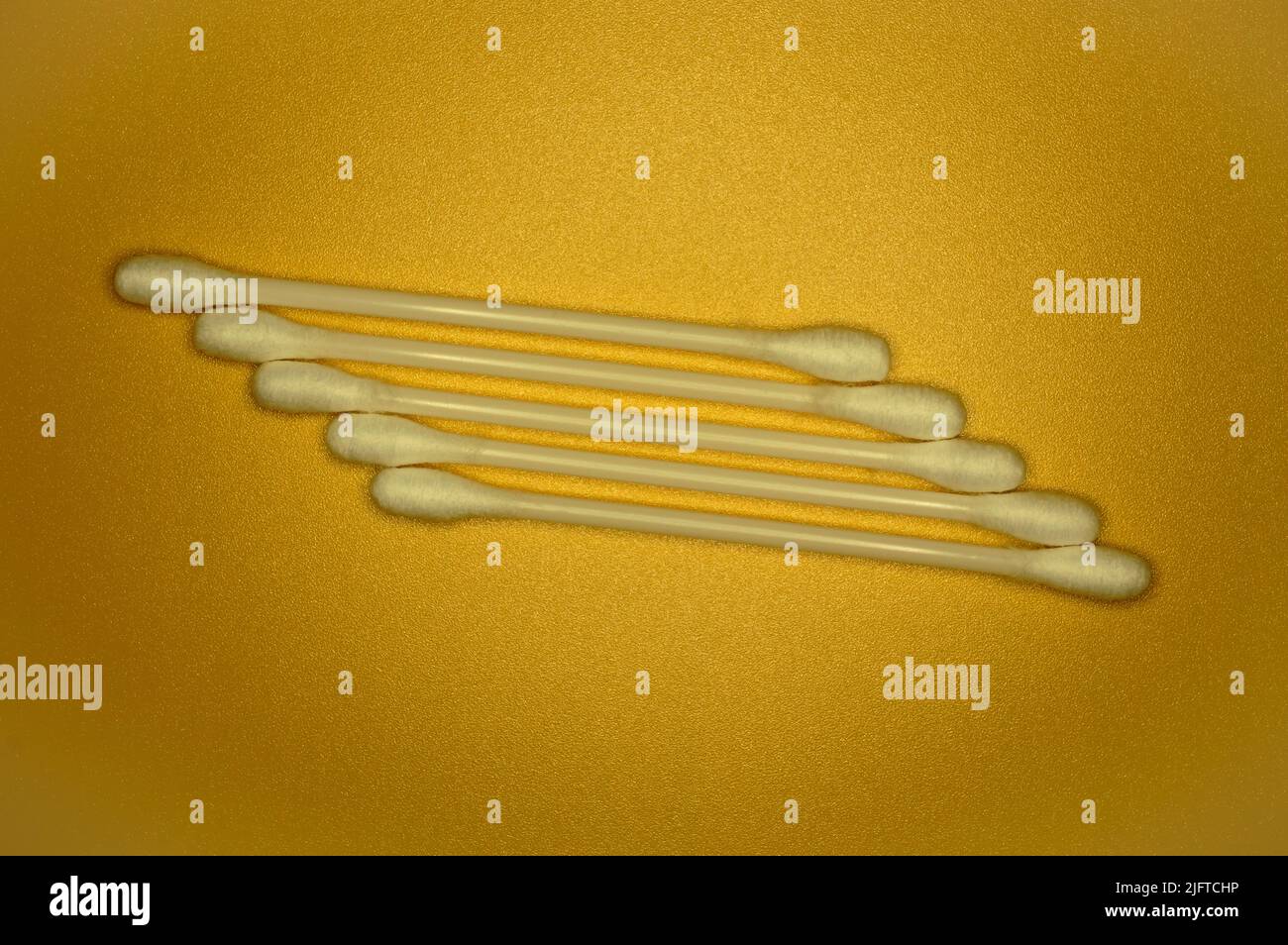 White cotton buds on an orange background Stock Photo Alamy