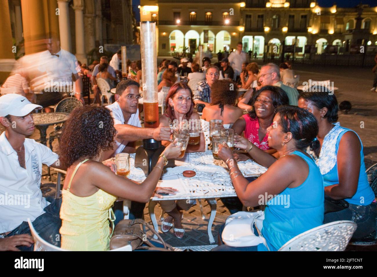 Cuba, Havana, Taberna de la Muralla is set up by an austrian company and has home made beer served in long plastic tubes. Stock Photo