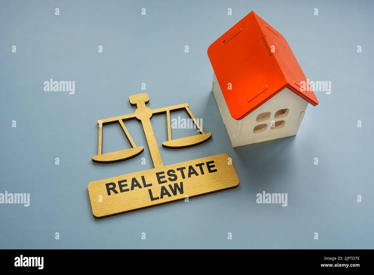 Model of the house and a sign real estate law. Stock Photo