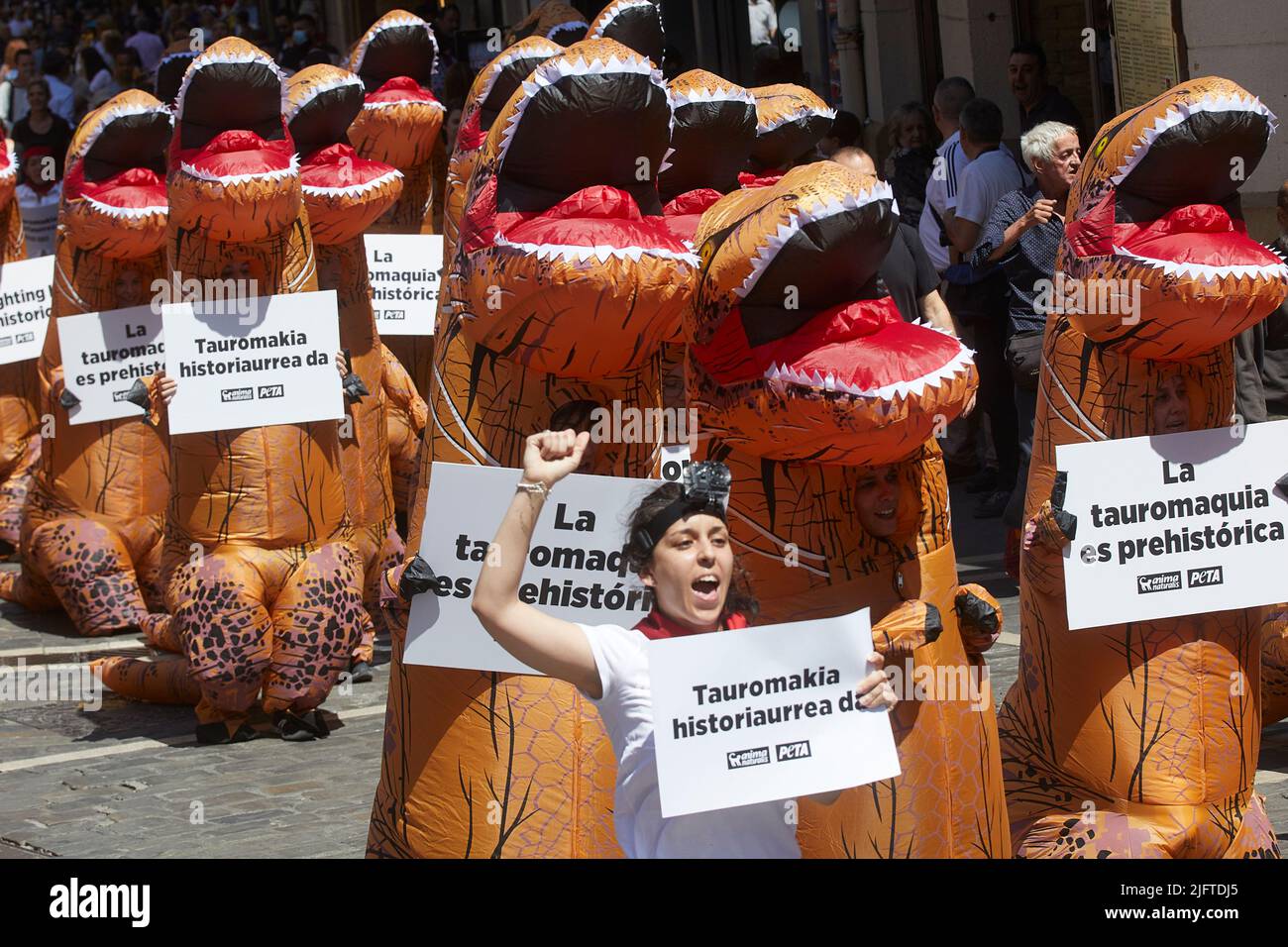 Pamplona. Spain. 5th Jul, 2022. The organizations in defense of animals 'AnimaNaturalis' and 'PETA' organize a protest against bullfighting in Pamplona in the course of the running of the bulls under the slogan 'Bullfighting is prehistoric' on the day before the start of the San fermin Festival. Credit: Iñigo Alzugaray/Alamy Live News Stock Photo