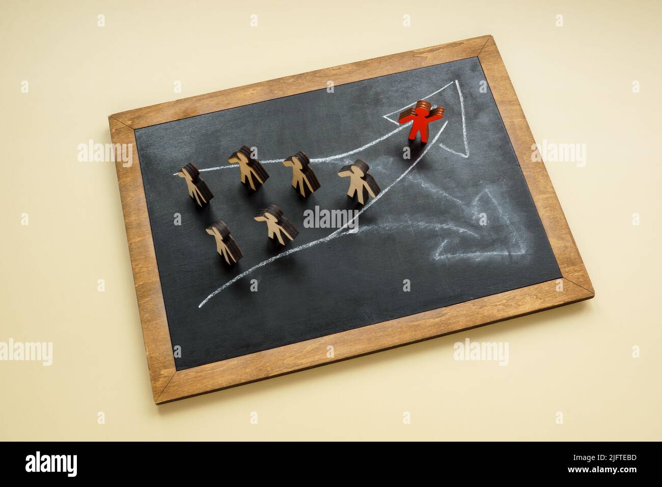 Arrows on the board and figures. Leadership in choice and change. Stock Photo
