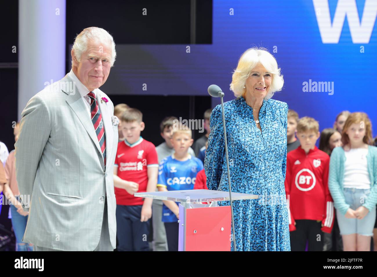 The Prince of Wales and the Duchess of Cornwall in the Atrium with children and members of the Urdd from Ysgol Talsarnau and Ysgol Cefn Coch in Gwynedd during a visit to BBC Wales's new headquarters in Cardiff for the launch of the broadcaster's public tours. Picture date: Tuesday July 5, 2022. Stock Photo