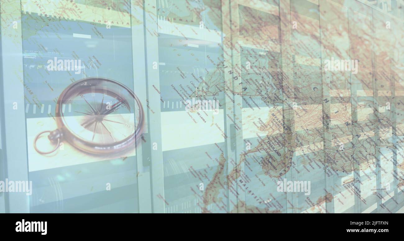 Digital composition of compass and world map against computer server room. computer interface and networking technology concept Stock Photo