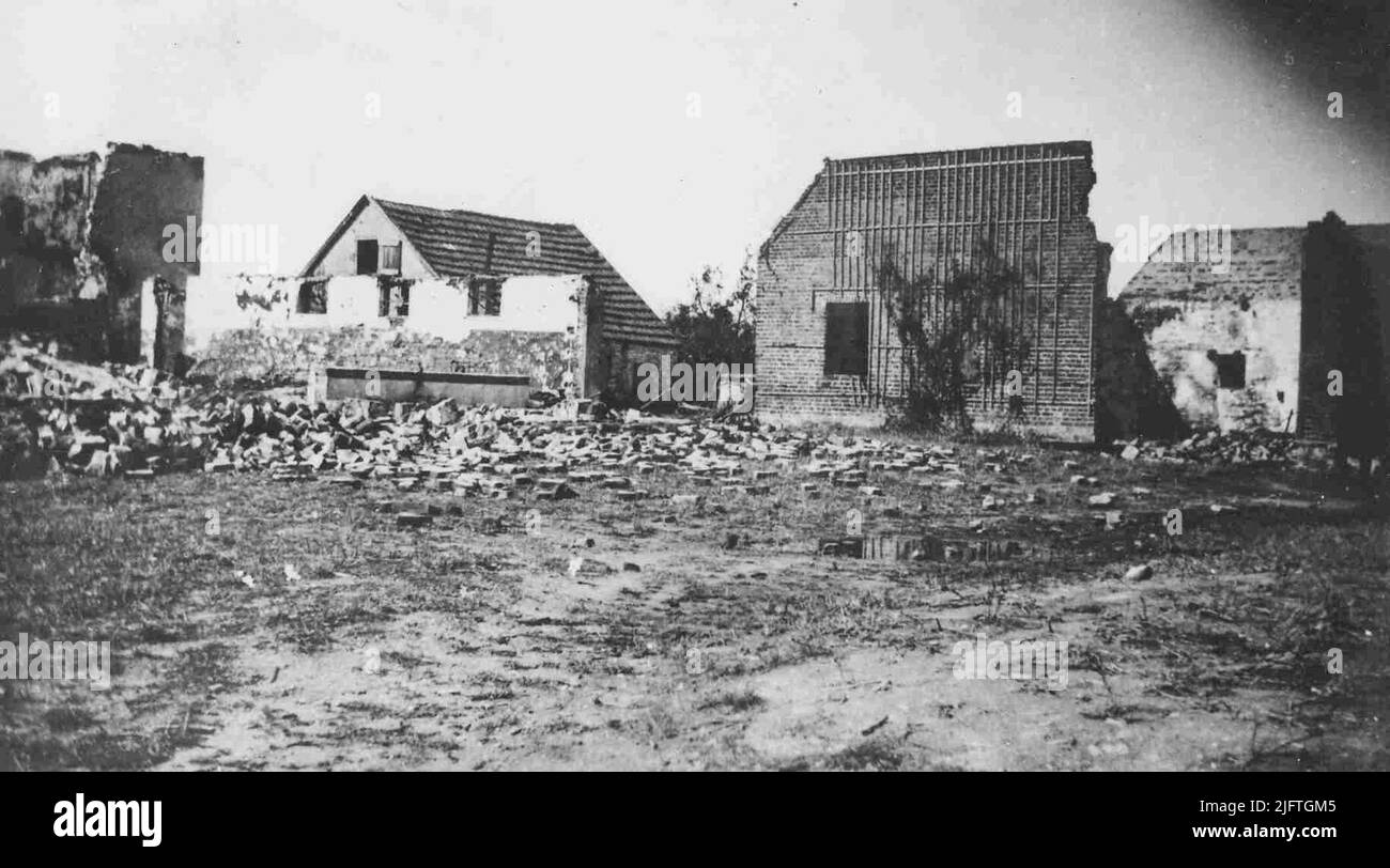 Bombed houses. The destroyed farm was owned by Johan Welles Stock Photo