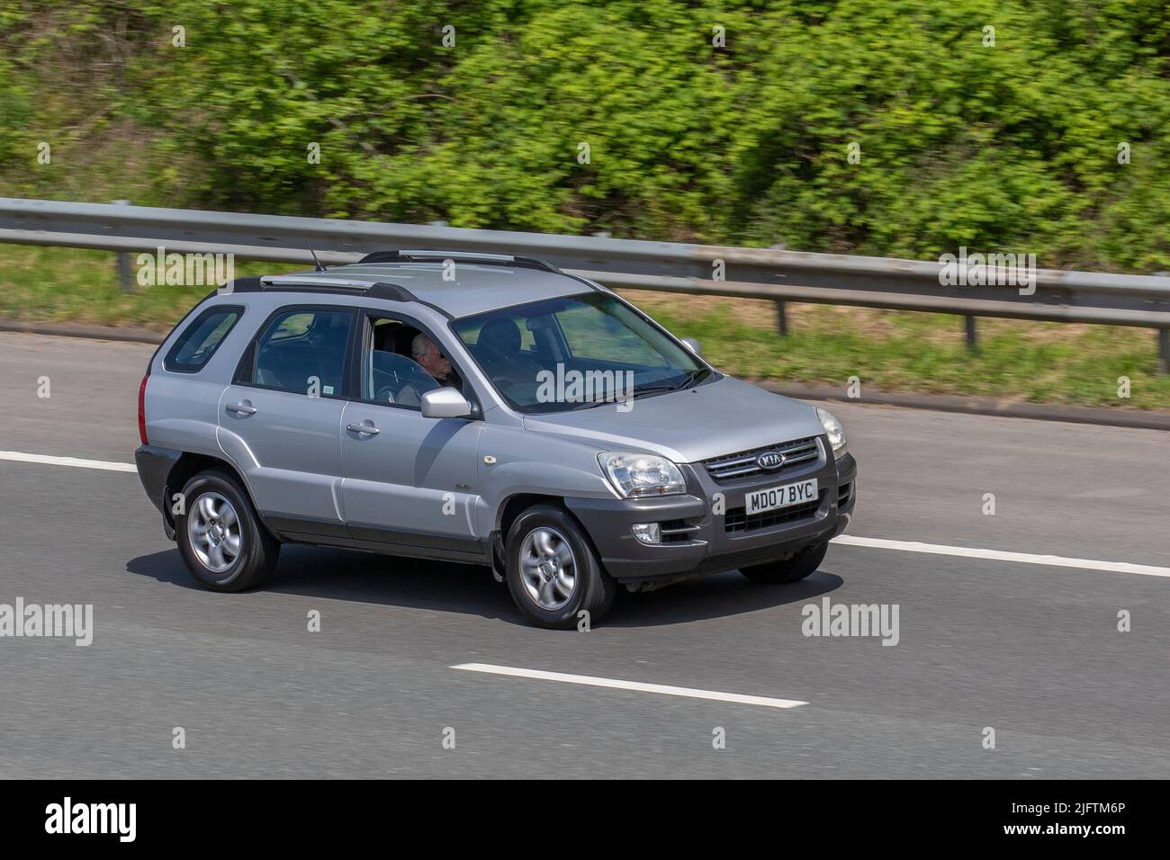 2007 Silver KIA Sportage Xe Crdi 138 1991cc Diesel SUV; driving on the M6 Motorway, Manchester, UK Stock Photo